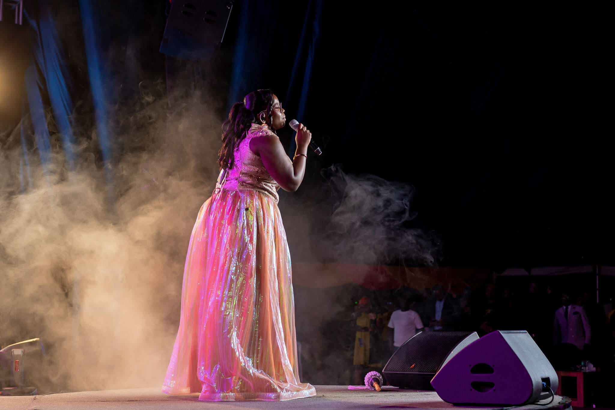 Purity Atieno at the stage performing
